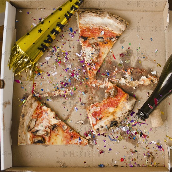 Slices of pizza and confetti in in box. 
Photo: Jamie Grill