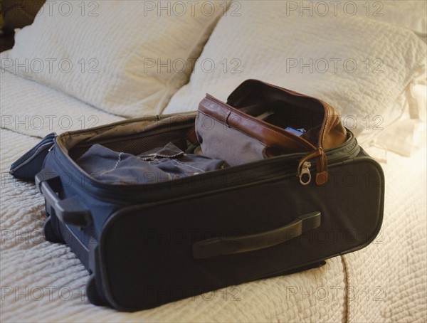 Suitcase on bed. 
Photo: Jamie Grill