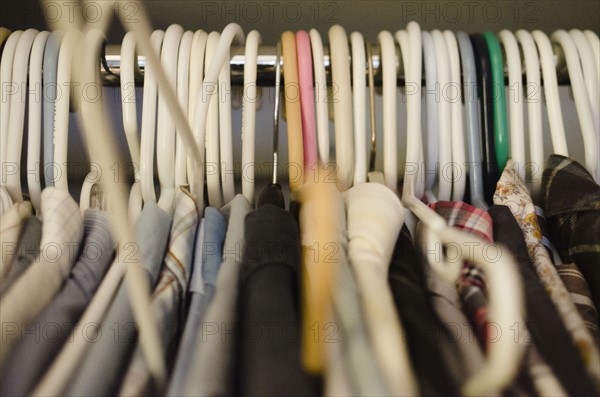 Coat hangers with clothing. 
Photo : Jamie Grill