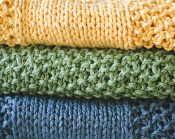 Stack of knitted blankets. 
Photo : Jamie Grill