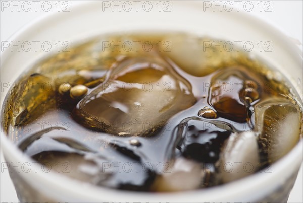 Close-up of soda in disposable cup. 
Photo : Jamie Grill