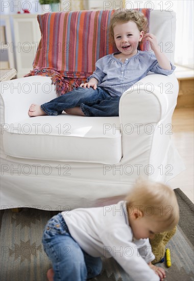 Brother and sister (2-3, 6-11 months) at home. 
Photo: Jamie Grill