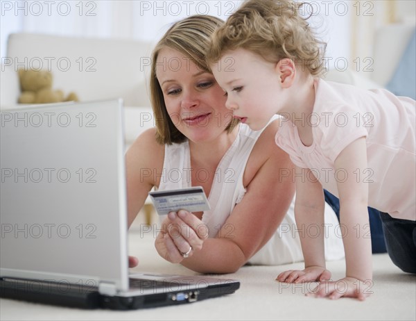 Mother and daughter (2-30 online shopping. 
Photo : Jamie Grill