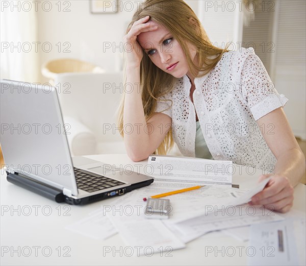 Woman doing paperwork. 
Photo: Jamie Grill