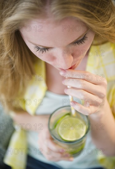 Woman drinking water. 
Photo : Jamie Grill