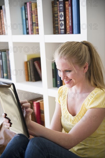 Woman using digital tablet. 
Photo : Jamie Grill