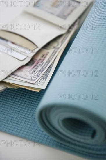 Money on yoga mat. 
Photo : Jamie Grill