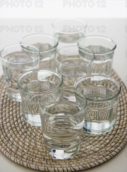 Water in glasses on place mat. 
Photo : Jamie Grill