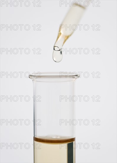 Pipetting liquid into test tube. 
Photo : Jamie Grill