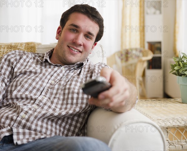 man watching tv. 
Photo : Jamie Grill