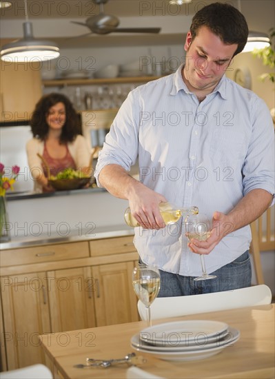 Couple preparing dinner. 
Photo : Jamie Grill