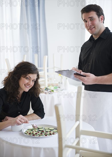 Waiter taking order. 
Photo : Jamie Grill