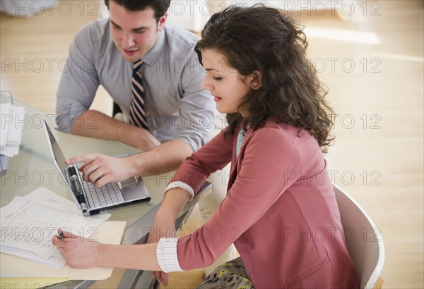 Business people working in office. 
Photo : Jamie Grill