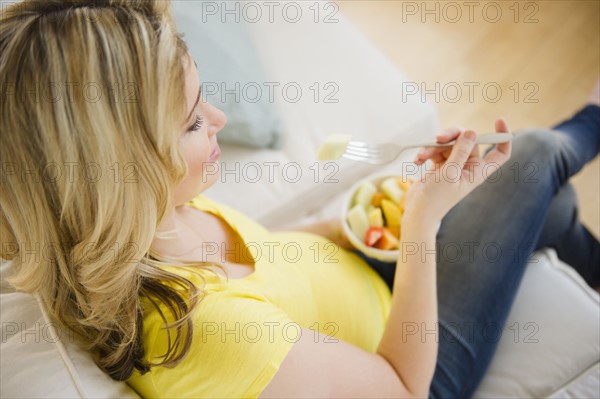 Pregnant woman eating fruit salad. 
Photo: Jamie Grill