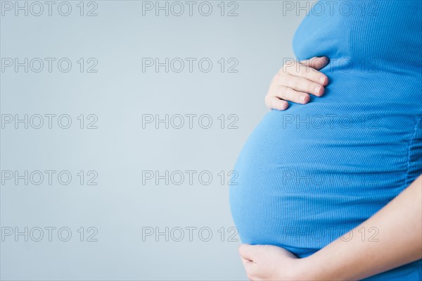 Belly of pregnant woman. 
Photo : Jamie Grill