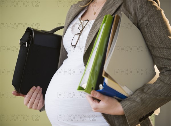 Pregnant business woman. 
Photo : Jamie Grill