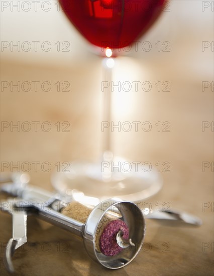 Corkscrew and glass of wine. 
Photo : Jamie Grill