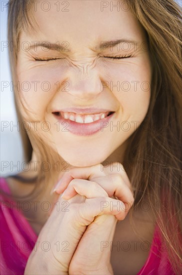 Close-up of praying woman. 
Photo : Jamie Grill