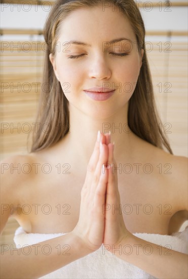 Woman meditating in spa. 
Photo: Jamie Grill