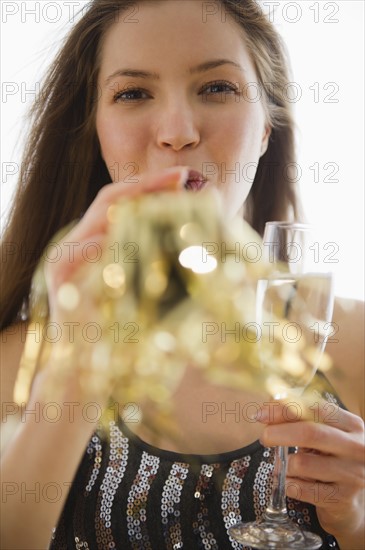 Woman blowing party horn blower. 
Photo: Jamie Grill