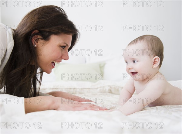 Mother with baby daughter (6-11 months) . 
Photo : Jamie Grill