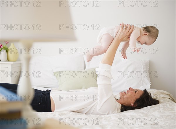 Mother with baby daughter (6-11 months) . 
Photo : Jamie Grill