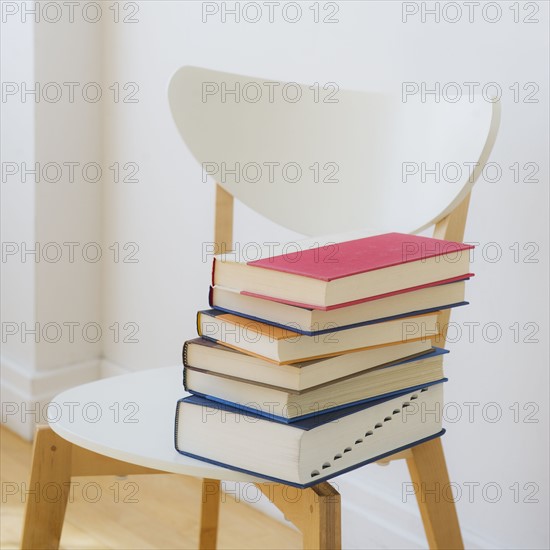 Close up of book on a chair, studio shot. 
Photo: Daniel Grill