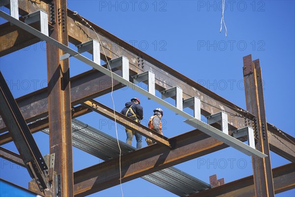 Construction workers on construction frame. 
Photo: fotog