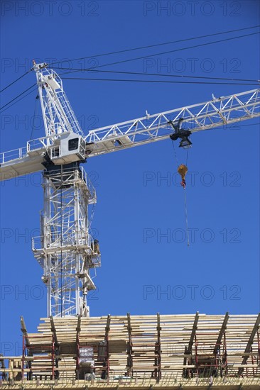 Crane on construction site. 
Photo : fotog