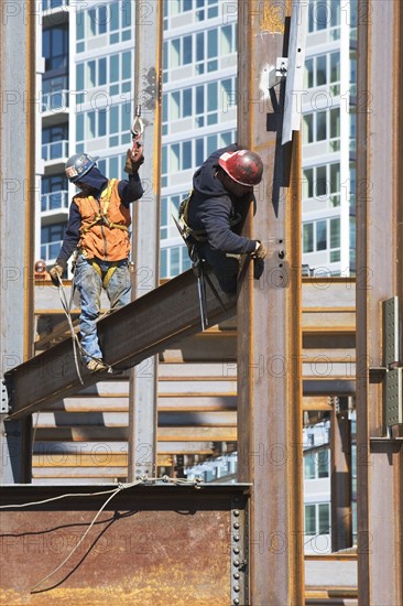 USA, New York, Long Island, New York City, Male workers on construction site. 
Photo: fotog