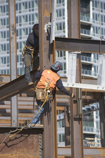 USA, New York, Long Island, New York City, Male workers on construction site. 
Photo: fotog