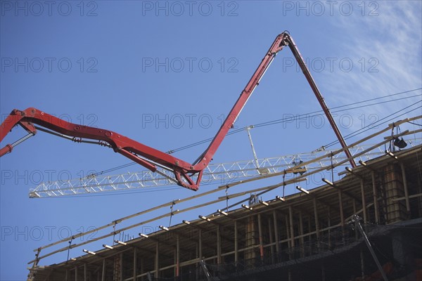 Cranes on construction site. 
Photo : fotog