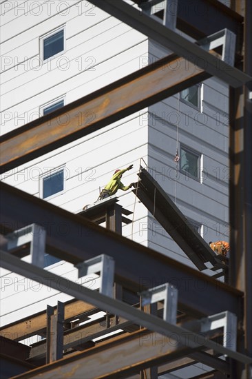 USA, New York, Long Island, New York City, Male workers on construction site. 
Photo: fotog