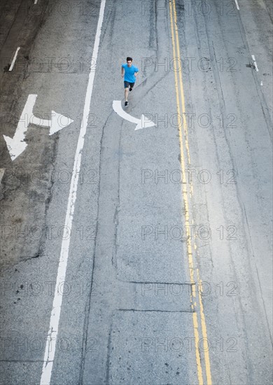 USA, California, Los Angeles, Elevated view of man and man running on street.