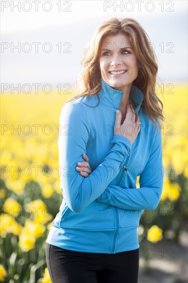 USA, Washington, Skagit Valley, Portrait of woman in blue tracksuit. 
Photo: Take A Pix Media