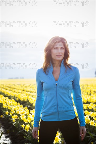 USA, Washington, Skagit Valley, Portrait of woman in blue tracksuit. 
Photo: Take A Pix Media