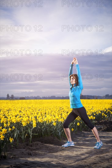 USA, Washington, Skagit Valley, Woman exercising in rural area. 
Photo: Take A Pix Media