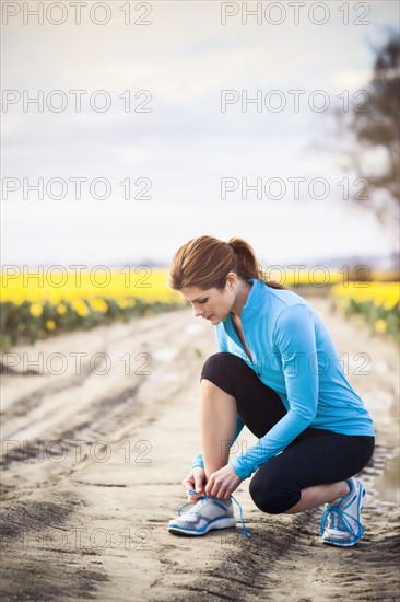 USA, Washington, Skagit Valley, Woman exercising in rural area. 
Photo: Take A Pix Media