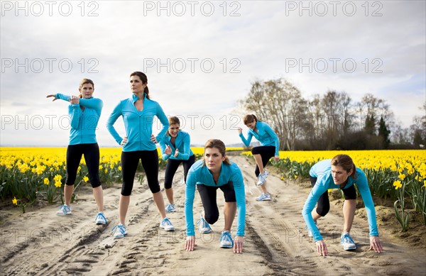 USA, Washington, Skagit Valley, Woman exercising in rural area. 
Photo: Take A Pix Media