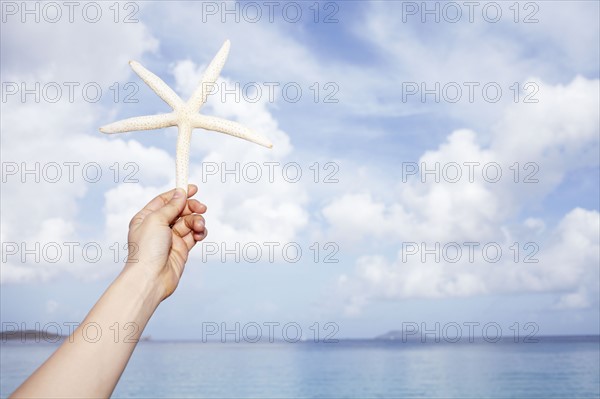 United States Virgin Islands, St. John, Starfish held by female hand. 
Photo : Winslow Productions