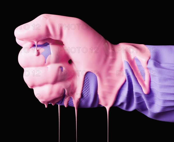 Human fist in rubber glove dripping with wet paint. 
Photo : Mike Kemp