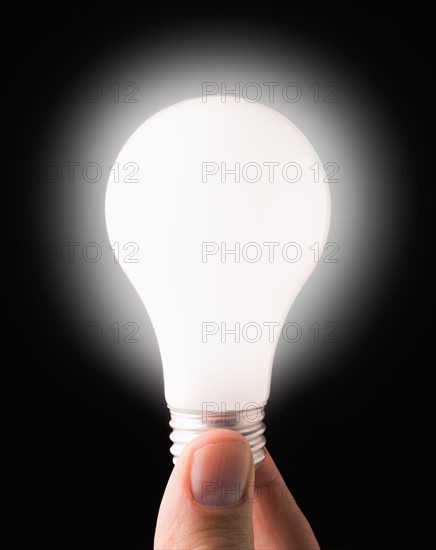 Close-up of lit light bulb. 
Photo: Mike Kemp