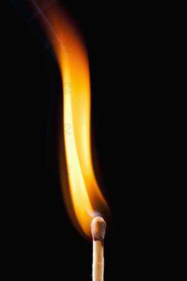 Close-up of burning match. 
Photo : Mike Kemp