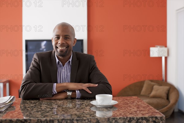 Man enjoying coffee at home. 
Photo: Dan Bannister