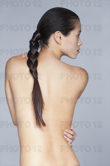 Nude of young woman with plait. 
Photo : Jan Scherders