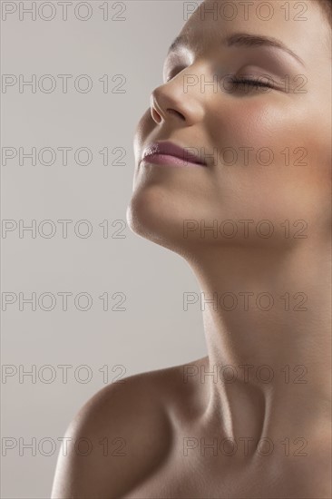 Portrait of young woman with eyes closed. 
Photo: Jan Scherders