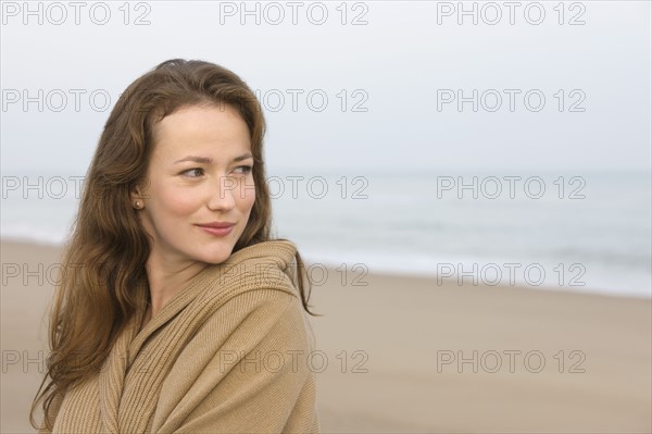 Young woman on empty beach. 
Photo: Jan Scherders