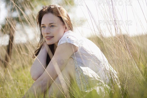 Young woman relaxing on meadow. 
Photo: Jan Scherders