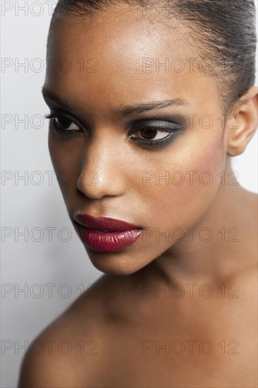 Portrait of young woman in seductive make-up. 
Photo : Jan Scherders