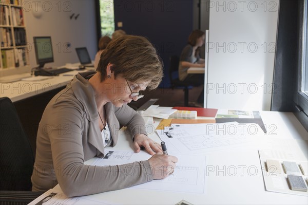 Employees of design agency at work. 
Photo : Jan Scherders